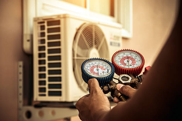 Professional Air Conditioning Service technician working in Jacksons Gap, AL